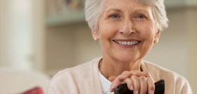 Elderly woman smiling at home