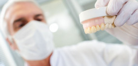 Dentist holding mould
