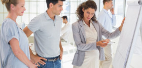 Pregnant businesswoman presenting her ideas in the office