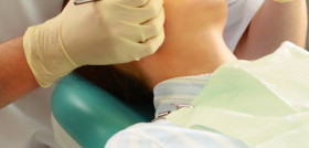Young woman with dentist in a dental surgery. Healthcare