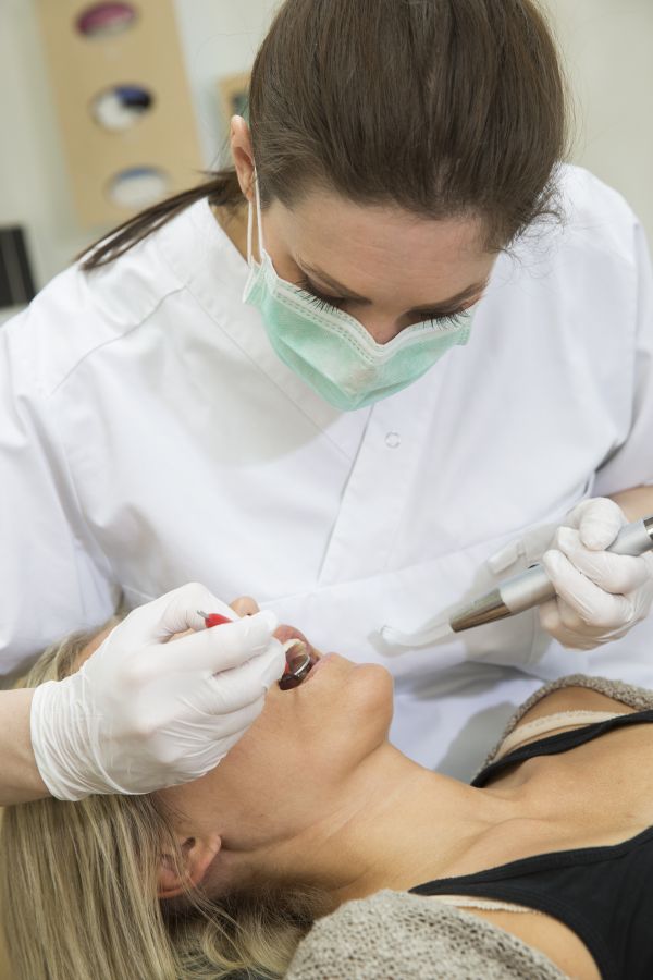 Female dentist and patient